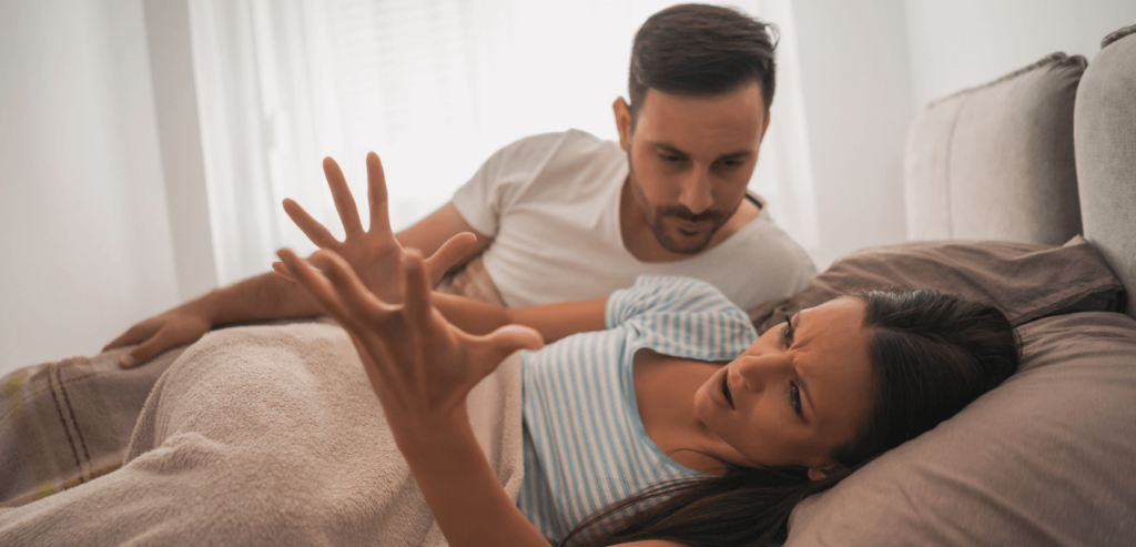 Couple arguing lying on top of the bed early morning