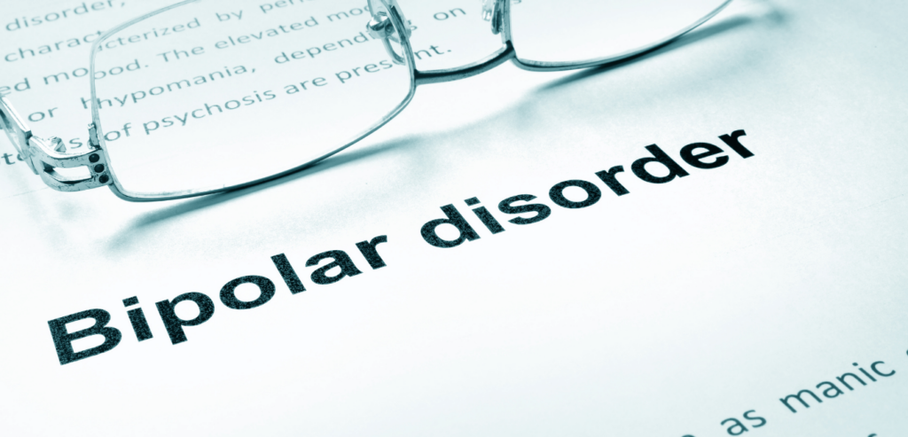 Bipolar disorder focused on a paper with glasses