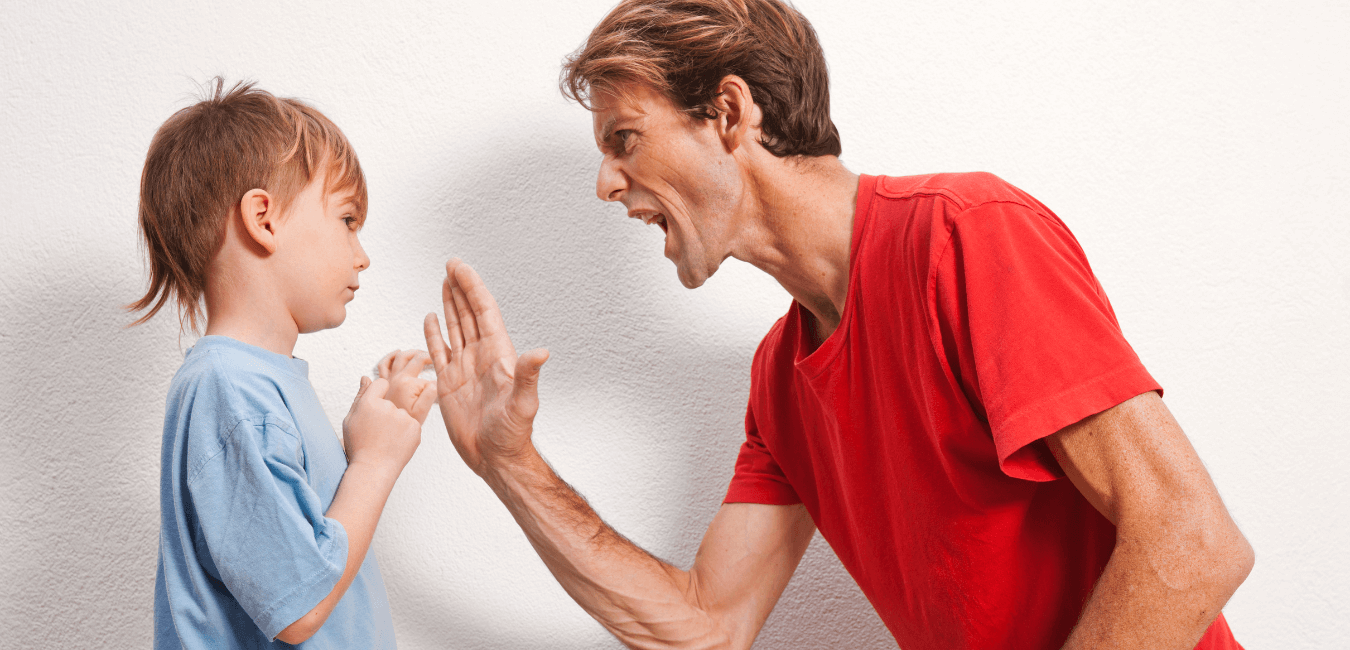 Angry father scolding his son at home